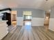 Open floorplan, light gray walls, featuring seamless flow and wood-look floors at 771 Doran Ave, Shelbyville, IN 46176