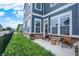 Relaxing back patio with charming outdoor seating, a well-kept lawn, and scenic views of the neighborhood at 776 Templeton Dr, Carmel, IN 46032