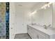 Bright bathroom features double vanity, ample lighting, and a tiled walk-in shower, creating a spa-like atmosphere at 776 Templeton Dr, Carmel, IN 46032