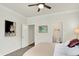 Bedroom featuring neutral paint, ceiling fan, carpet flooring, and ensuite access to bathroom for added convenience at 776 Templeton Dr, Carmel, IN 46032