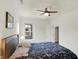 Bedroom featuring neutral walls, carpet flooring, ceiling fan, large window, and closet for ample storage at 776 Templeton Dr, Carmel, IN 46032