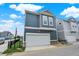 Charming townhouse with a two-car garage, complemented by blue siding and white trim at 776 Templeton Dr, Carmel, IN 46032