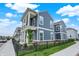 Charming two-story home with large front porch, white columns, fenced in yard and blue siding at 776 Templeton Dr, Carmel, IN 46032
