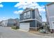 Attractive townhouse showcases a two-car garage and modern siding, nestled in a friendly community at 776 Templeton Dr, Carmel, IN 46032