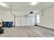 Spacious two car garage providing ample parking and storage, featuring bright lighting and concrete flooring at 776 Templeton Dr, Carmel, IN 46032