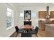 Eat-in kitchen with breakfast nook, modern cabinetry, granite countertops, and views of the backyard at 776 Templeton Dr, Carmel, IN 46032