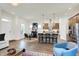 Open kitchen featuring an island with granite countertops, stainless steel appliances, and hardwood floors at 776 Templeton Dr, Carmel, IN 46032