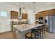 Spacious kitchen with a large island, stainless steel appliances, granite countertops and wood cabinetry at 776 Templeton Dr, Carmel, IN 46032