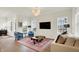 Bright living room featuring hardwood floors, recessed lighting, large windows, and comfortable seating at 776 Templeton Dr, Carmel, IN 46032