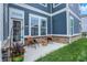 Cozy outdoor patio with seating, brick base, and garden, perfect for relaxing or entertaining at 776 Templeton Dr, Carmel, IN 46032