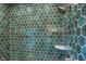 Modern shower features dark green honeycomb tiles and a showerhead for a spa-like retreat at 776 Templeton Dr, Carmel, IN 46032