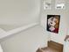 Upper staircase landing area with natural light and decorative wall art at 776 Templeton Dr, Carmel, IN 46032