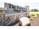 Elegant stone signage for 'The Fields at Sugar Creek' community entrance at 7877 Magnolia St, New Palestine, IN 46163