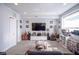 Basement entertainment area with a glass coffee table and large tv at 806 Shelby St, Indianapolis, IN 46203
