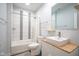 Bright bathroom with a modern vanity, sleek sink, tiled shower-tub combination, and stylish fixtures at 806 Shelby St, Indianapolis, IN 46203