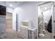Bedroom with white shelving, laundry hamper, and closet with stored items at 806 Shelby St, Indianapolis, IN 46203