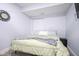 Bedroom with gray carpet, a queen bed, a clock, and a nightstand with a safe at 806 Shelby St, Indianapolis, IN 46203