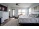 Spacious bedroom with a large bed, hardwood floors, and plenty of natural light at 806 Shelby St, Indianapolis, IN 46203