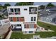 Unique modern home with multiple balconies and a well-maintained yard, perfect for outdoor enjoyment and curb appeal at 806 Shelby St, Indianapolis, IN 46203