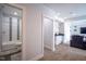 Open-concept interior view highlighting a wet bar, cozy seating area, and a glimpse into the well-lit bathroom at 806 Shelby St, Indianapolis, IN 46203