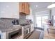Contemporary kitchen with a gas range, stainless steel appliances, and granite counters at 806 Shelby St, Indianapolis, IN 46203