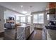 Open concept kitchen with an island, bar seating, stainless appliances, and hardwood floors at 806 Shelby St, Indianapolis, IN 46203