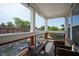Welcoming porch with classic white columns and an inviting seating area with a view of the street at 806 Shelby St, Indianapolis, IN 46203