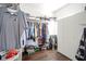 Spacious walk-in closet with ample hanging space, shelving, and a built-in storage cabinet at 806 Shelby St, Indianapolis, IN 46203