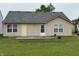 Backyard features a patio and partial view of the home's rear exterior at 8113 Maple Stream Ln, Indianapolis, IN 46217