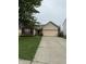 Charming single-story home with a well-manicured lawn and a two-car attached garage, featuring brick and siding accents at 8113 Maple Stream Ln, Indianapolis, IN 46217
