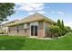 Backyard featuring a well-manicured lawn and vinyl siding at 8115 Cole Wood Blvd, Indianapolis, IN 46239