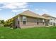Exterior view of home with siding, showcasing well-maintained lawn and landscaping at 8115 Cole Wood Blvd, Indianapolis, IN 46239