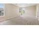 Bright bedroom with neutral carpet and ample natural light from two windows at 8115 Cole Wood Blvd, Indianapolis, IN 46239