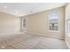 Large bedroom with neutral carpet and three windows for natural light at 8115 Cole Wood Blvd, Indianapolis, IN 46239
