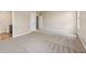 Spacious bedroom with neutral carpet and attached bathroom at 8115 Cole Wood Blvd, Indianapolis, IN 46239