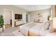 Staged bedroom featuring a bed, TV, and modern furniture at 8115 Cole Wood Blvd, Indianapolis, IN 46239
