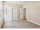 Bedroom showcasing sliding door closet, open doorway, and a window at 8115 Cole Wood Blvd, Indianapolis, IN 46239