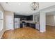 Spacious kitchen featuring stainless appliances, dark cabinets, and hardwood floors at 8115 Cole Wood Blvd, Indianapolis, IN 46239