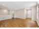 A bright, open-concept living room featuring hardwood floors, recessed lighting, and neutral paint, perfect for entertaining at 8115 Cole Wood Blvd, Indianapolis, IN 46239