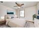 Stylishly staged bedroom with soft carpet, neutral tones, and a ceiling fan for a cozy atmosphere at 817 S Jefferson St, Brownsburg, IN 46112