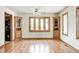 Bright dining room with hardwood floors, wood trim, and natural light from bay window at 817 S Jefferson St, Brownsburg, IN 46112