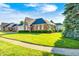 Charming brick home with well-kept lawn, mature trees, and a welcoming entrance at 817 S Jefferson St, Brownsburg, IN 46112