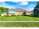 Brick ranch-style home with a well-manicured lawn and mature landscaping at 817 S Jefferson St, Brownsburg, IN 46112