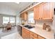 Functional kitchen featuring oak cabinets, neutral countertops, and a bright breakfast nook at 817 S Jefferson St, Brownsburg, IN 46112