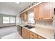 Functional kitchen featuring oak cabinets, neutral countertops, and a bright breakfast nook at 817 S Jefferson St, Brownsburg, IN 46112