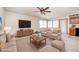 Staged living area with neutral tones, tv, comfortable furniture and bright, natural lighting at 817 S Jefferson St, Brownsburg, IN 46112