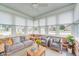 Cozy sunroom with ample natural light and stylish furnishings, perfect for relaxation and entertaining at 817 S Jefferson St, Brownsburg, IN 46112