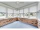 Sunroom bathed in natural light, showcasing neutral walls, large windows, and durable carpet flooring at 817 S Jefferson St, Brownsburg, IN 46112