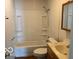 Simple bathroom featuring a tub/shower combo and a classic vanity at 822 W 7Th St, Muncie, IN 47302