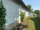 Side view of the house and backyard including the garage at 822 W 7Th St, Muncie, IN 47302